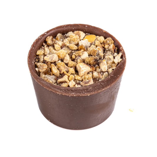Butter caramel - smooth butter caramel in a milk chocolate cup topped with roasted hazelnuts 13.7g