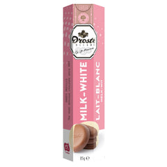 Milk and white chocolate pastilles in tube