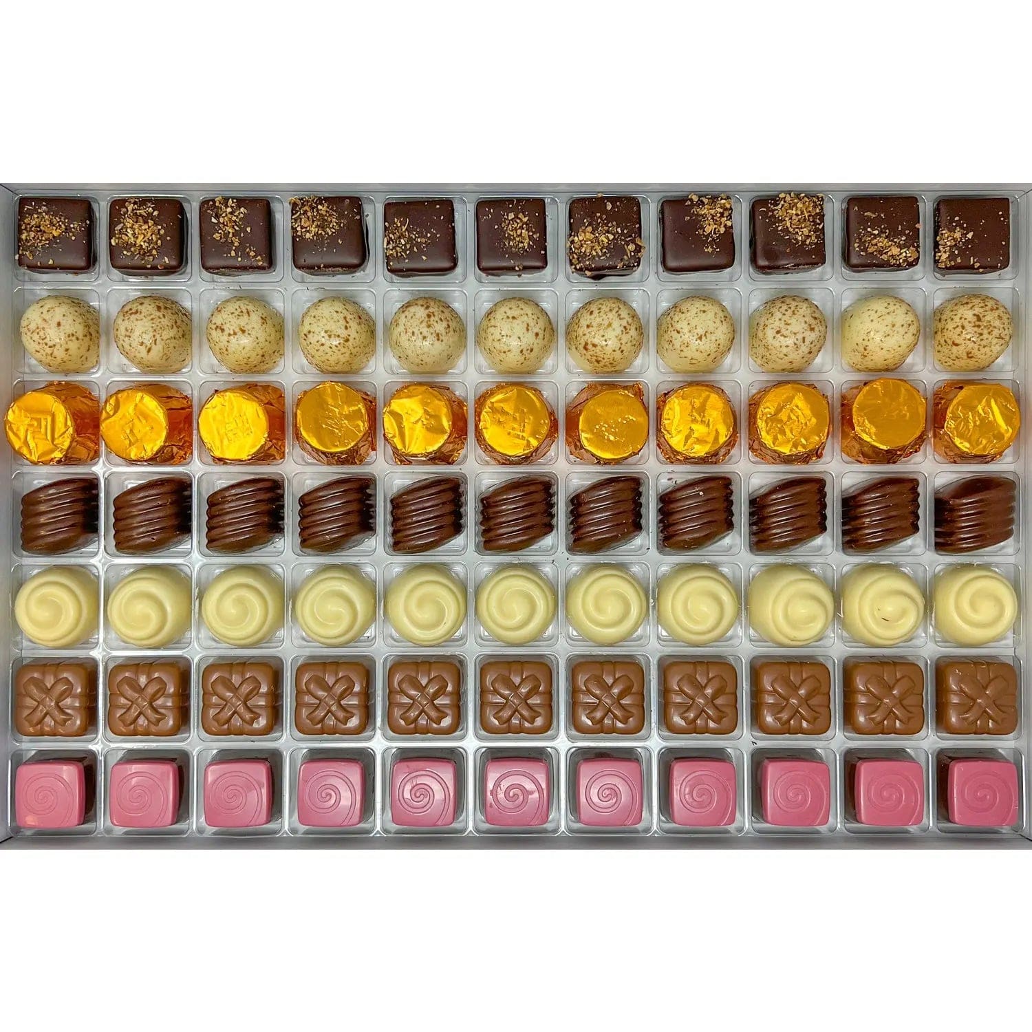 Jag Couture London - New York Classic Praline Selection - dark lemon, white hazelnut, milk salted caramel, white apricot, milk Irish cream, milk raspberry, dark pistachio